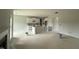Unfinished kitchen and living area with a fireplace, an island, and white cabinets at 202 Tuskeegee Dr, Smithfield, NC 27577