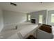 Unfinished living room and kitchen with a fireplace, a white door to the backyard, and a gray bucket at 202 Tuskeegee Dr, Smithfield, NC 27577