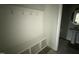 Mudroom with built-in bench storage and hooks; access to half bath at 202 Tuskeegee Dr, Smithfield, NC 27577