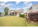 Well-manicured backyard with a screened-in porch and attractive landscaping features at 219 Rosedale Creek Dr, Durham, NC 27703