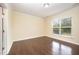 Bright bedroom with hardwood floors, large window providing natural light and ample space at 219 Rosedale Creek Dr, Durham, NC 27703