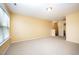 Large bedroom with carpet flooring, a window providing natural light, and neutral colored walls at 219 Rosedale Creek Dr, Durham, NC 27703