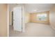 Bright bedroom with carpet flooring, light colored walls, and a window with blinds at 219 Rosedale Creek Dr, Durham, NC 27703