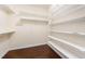 Walk-in closet with custom shelving, offering ample storage space at 219 Rosedale Creek Dr, Durham, NC 27703