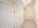 Walk-in closet features neutral carpet and one wire shelf for optimal storage capacity at 219 Rosedale Creek Dr, Durham, NC 27703