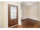 Inviting foyer with beautiful hard wood floors and decorative front door at 219 Rosedale Creek Dr, Durham, NC 27703
