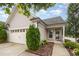 Charming home featuring a two-car garage, and beautifully landscaped front yard at 219 Rosedale Creek Dr, Durham, NC 27703