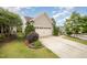 Charming home featuring a two-car garage, and beautifully landscaped front yard at 219 Rosedale Creek Dr, Durham, NC 27703
