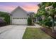 Charming home featuring a two-car garage, and beautifully landscaped front yard at 219 Rosedale Creek Dr, Durham, NC 27703