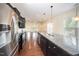Gourmet kitchen featuring stainless steel appliances and large center island at 219 Rosedale Creek Dr, Durham, NC 27703