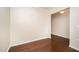 Open-concept living room featuring gleaming hardwood floors and neutral paint at 219 Rosedale Creek Dr, Durham, NC 27703
