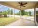 Spacious screened porch featuring a ceiling fan and views of the front yard at 219 Rosedale Creek Dr, Durham, NC 27703