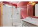 Bright bathroom with a glass enclosed shower, white subway tiles, and modern fixtures at 2212 Plowridge Rd, Fuquay Varina, NC 27526