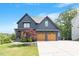 Charming two-story home featuring a two-car garage, covered entry, and well-manicured lawn at 2212 Plowridge Rd, Fuquay Varina, NC 27526