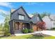 Charming two-story home featuring a covered entry, two-car garage, and landscaped yard at 2212 Plowridge Rd, Fuquay Varina, NC 27526