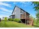 Beautiful home exterior featuring a screened porch and a well-maintained yard with lush greenery at 2212 Plowridge Rd, Fuquay Varina, NC 27526