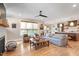 Inviting living room with a fireplace, hardwood floors, and open-concept design to the kitchen at 2212 Plowridge Rd, Fuquay Varina, NC 27526