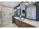 Luxurious bathroom with a walk-in shower, double vanity, and elegant tile work at 223 Lindo Johnson Rd, Pittsboro, NC 27312