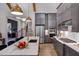 Spacious kitchen with stainless steel appliances, marble countertops, and sleek cabinets at 223 Lindo Johnson Rd, Pittsboro, NC 27312