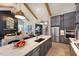Open concept kitchen with a large island, stainless steel appliances, and modern lighting at 223 Lindo Johnson Rd, Pittsboro, NC 27312