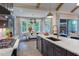 Gourmet kitchen featuring a stylish island and seamless flow to the adjacent dining area at 223 Lindo Johnson Rd, Pittsboro, NC 27312