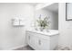 Elegant bathroom featuring double sinks, a large mirror, and modern fixtures at 228 Moyer Dr, Graham, NC 27253