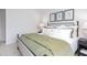 Well-decorated bedroom with a comfortable bed, side tables, and stylish wall art at 228 Moyer Dr, Graham, NC 27253