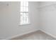 Walk-in closet with neutral carpet, a window, and shelving at 228 Moyer Dr, Graham, NC 27253