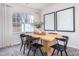 Bright dining area with modern table, chairs, and elegant framed artwork at 232 Moyer Dr, Graham, NC 27253