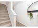Bright entryway featuring a staircase, white walls, and stylish decor accents at 232 Moyer Dr, Graham, NC 27253