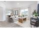 Cozy living room with a large window, comfortable seating, and stylish decor at 232 Moyer Dr, Graham, NC 27253