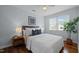 Bright bedroom featuring hard wood floors, a ceiling fan, and stylish decor creating a comfortable setting at 2331 Bernard St, Raleigh, NC 27608