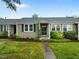 Charming exterior view of townhouse with lovely landscaping, neutral siding and inviting front entrance at 2331 Bernard St, Raleigh, NC 27608
