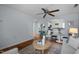 Cozy living room with wood floors, ceiling fan, an archway to kitchen, and light, neutral walls at 2331 Bernard St, Raleigh, NC 27608