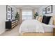 Well-lit bedroom boasts a decorative accent wall and a large window at 235 Moyer Dr # 191, Graham, NC 27253