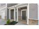 Inviting entryway with painted columns, hardiplank, and brick accents, adding a touch of elegance to the home's facade at 235 Moyer Dr # 191, Graham, NC 27253