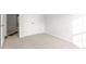 Bedroom with neutral carpet, white walls, closet and white doors at 236 Moyer Dr, Graham, NC 27253