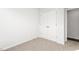 Neutral bedroom featuring a closet with double doors and beige carpet at 236 Moyer Dr, Graham, NC 27253