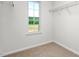 Walk-in closet features shelving and a window providing natural light at 236 Moyer Dr, Graham, NC 27253