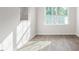 Dining area featuring hard wood floors and natural light coming through the large window at 236 Moyer Dr, Graham, NC 27253