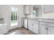 New kitchen featuring stainless steel appliances, white shaker cabinets and stone countertops at 236 Moyer Dr, Graham, NC 27253