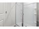 Frameless glass shower with white tiling at 236 Moyer Dr, Graham, NC 27253