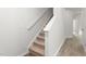 Interior view showcasing a carpeted staircase with white trim against neutral walls at 236 Moyer Dr, Graham, NC 27253