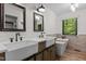 Beautiful bathroom featuring double sinks and a standalone tub at 237 Jason Way, Youngsville, NC 27596