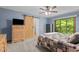Cozy bedroom featuring a barn door and natural light at 237 Jason Way, Youngsville, NC 27596
