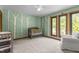 Bedroom with birch tree wallpaper, three large windows, neutral carpet and a gray crib in a cozy space at 237 Jason Way, Youngsville, NC 27596