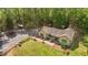 Ranch-style home nestled among mature trees, offers a private retreat with a storage building and fenced yard at 237 Jason Way, Youngsville, NC 27596