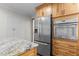 Kitchen featuring stainless steel appliances and wooden cabinets with modern design elements at 237 Jason Way, Youngsville, NC 27596