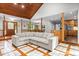 Open-concept living area with tile floors, wood accents, and an adjacent eat-in kitchen area at 237 Jason Way, Youngsville, NC 27596
