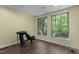 Salon style room with a shampoo bowl station, wood floors, neutral paint and two windows overlooking the wooded property at 237 Jason Way, Youngsville, NC 27596